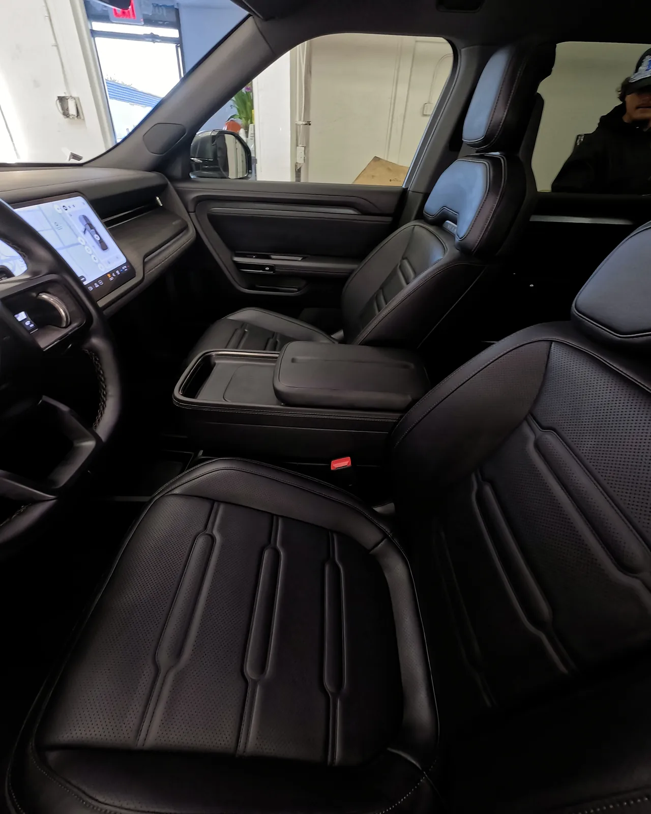Front seats and console of the Rivian R2 after cleaning — Oka's Car Care, Mountain View