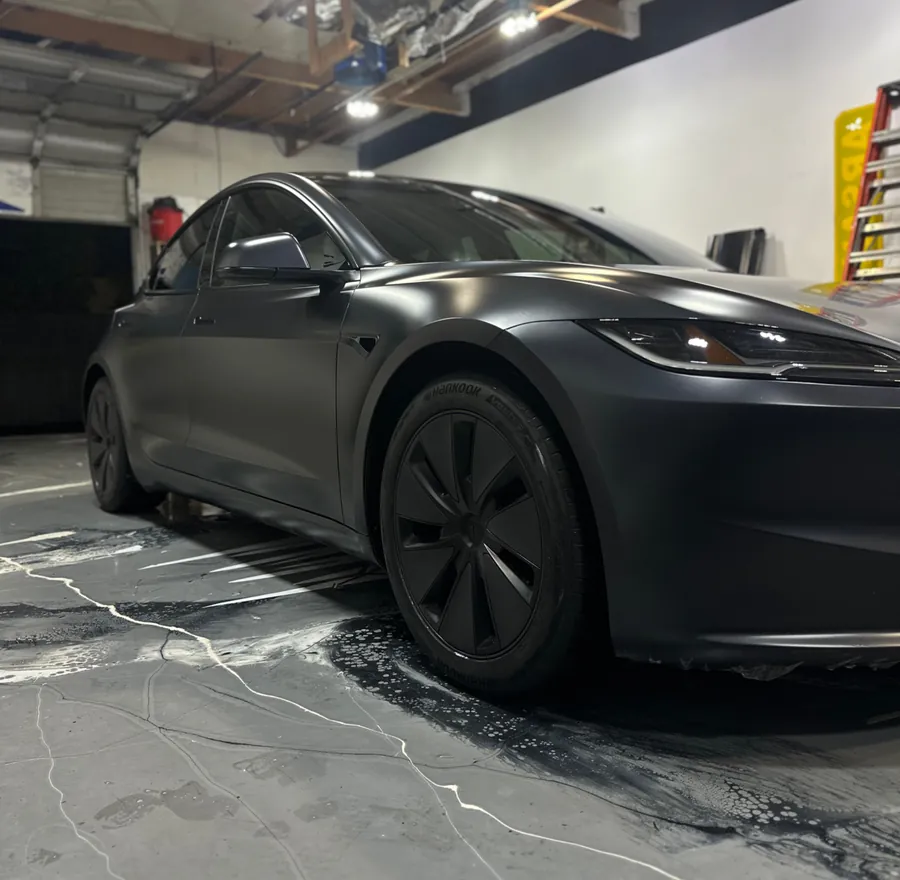 Tesla Model 3 in satin black, on the wash floor — Oka's Car Care, Mountain View