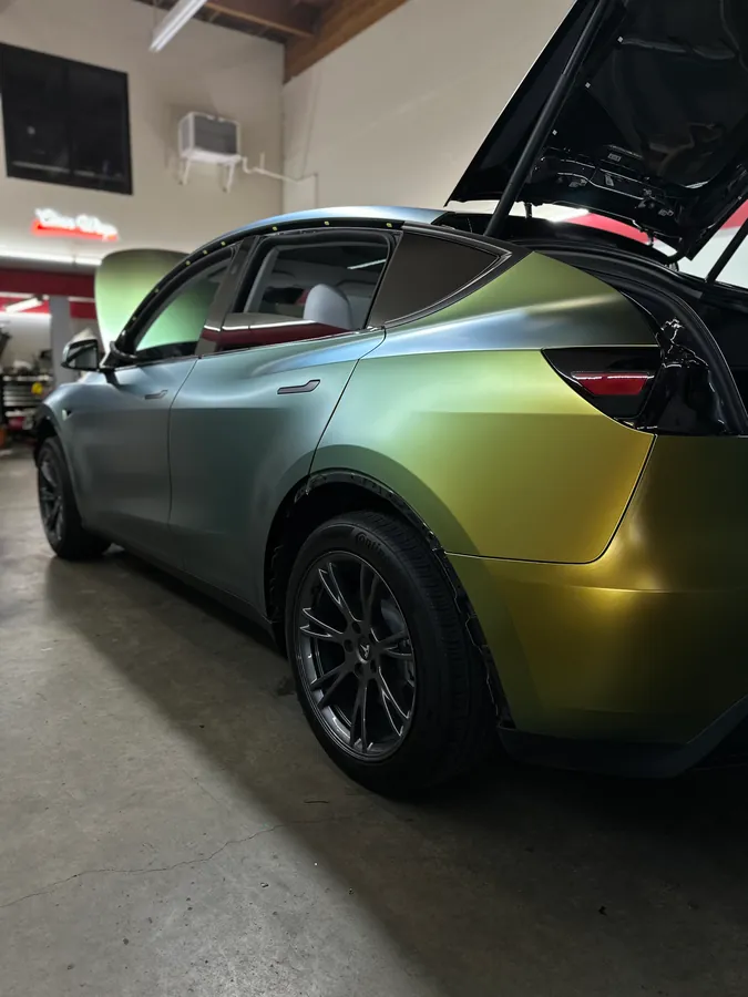 Tesla Model Y in a satin gold wrap