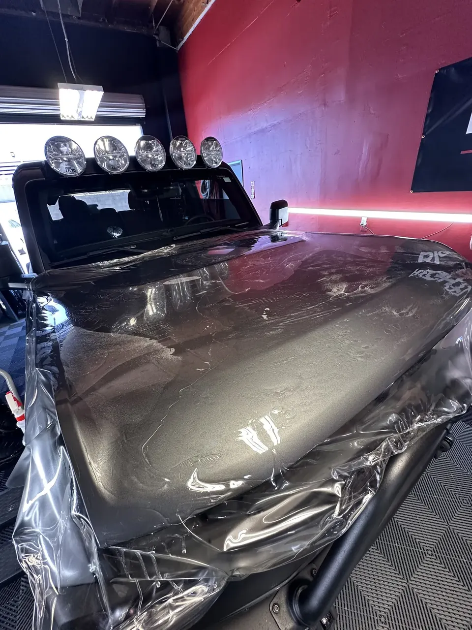 Clear paint protection film going onto a Jeep hood, paint protection film gallery, Oka's Car Care, Mountain View