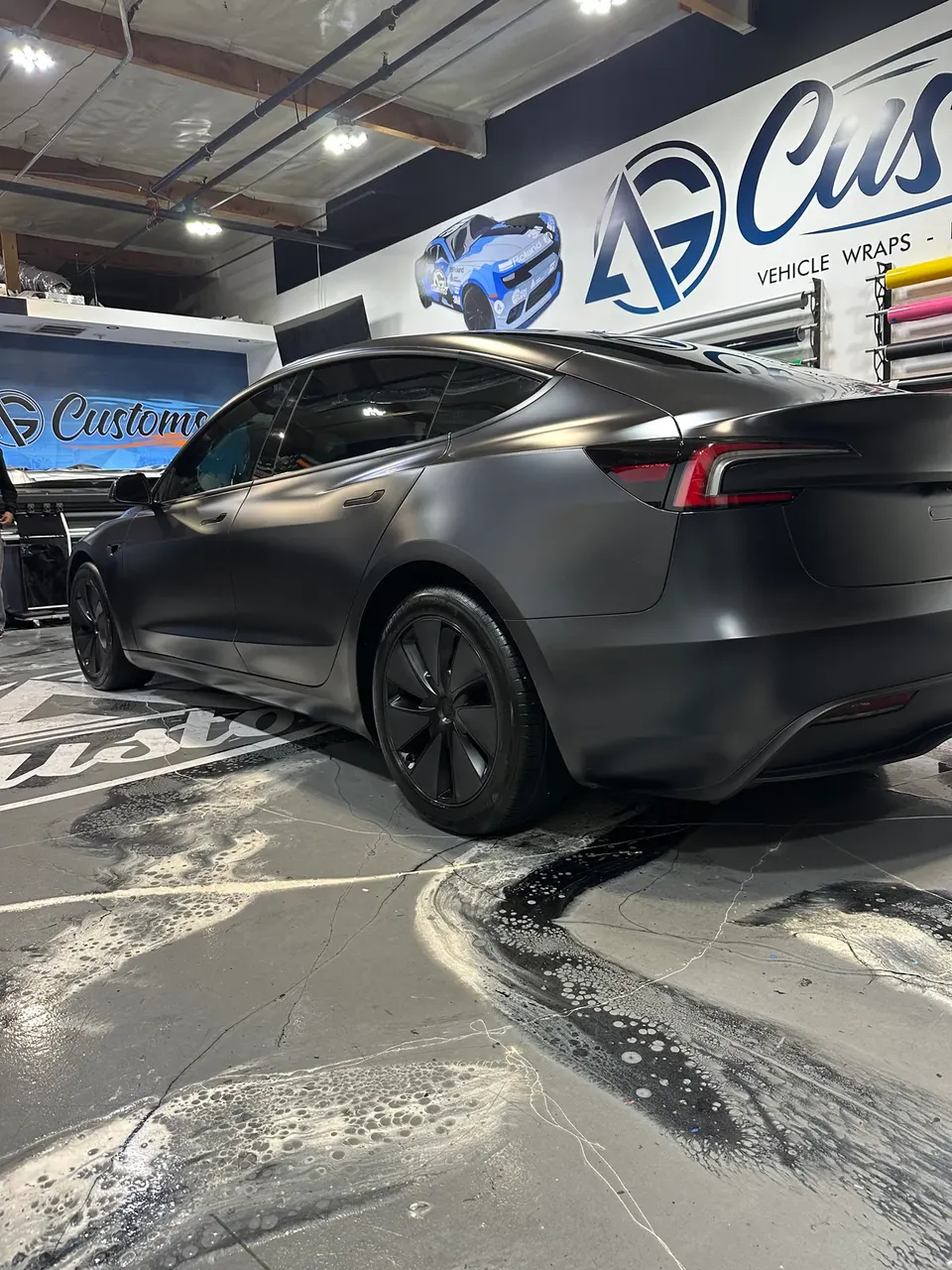 Tesla Model 3 in satin black, rear three-quarter, detailing gallery, Oka's Car Care, Mountain View